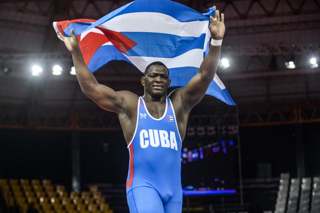 Cuba's Mijain Lopez celebrates after defeating Venezuela's Moises Perez to win the gold medal in the Wrestling Men's Greco-Roman 130 kg Final during the Lima 2019 Pan-American Games in Lima. 