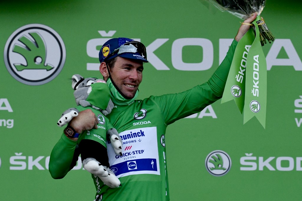 Team Deceuninck Quickstep's Mark Cavendish of Great Britain celebrates his green jersey of best sprinter on the podium at the end of the 10th stage of the 108th edition of the Tour de France cycling race, 190 km between Albertville and Valence, on July 06, 2021.