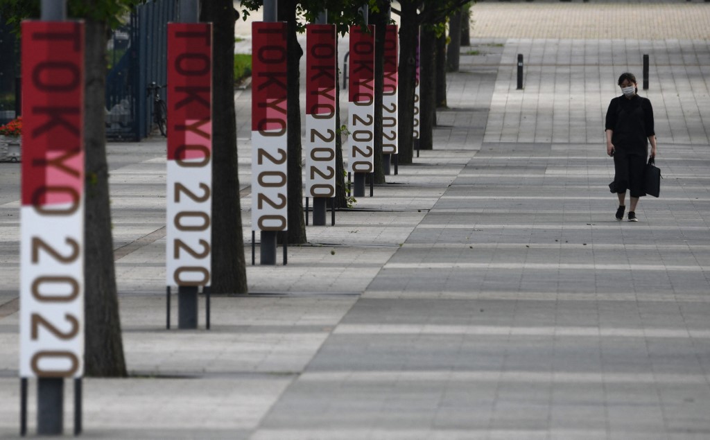 The logos of Tokyo 2020 are displayed at a steet near Odaiba Seaside Park in Tokyo on July 7, 2021, as reports said the Japanese government plans to impose a virus state of emergency in Tokyo during the Olympics.