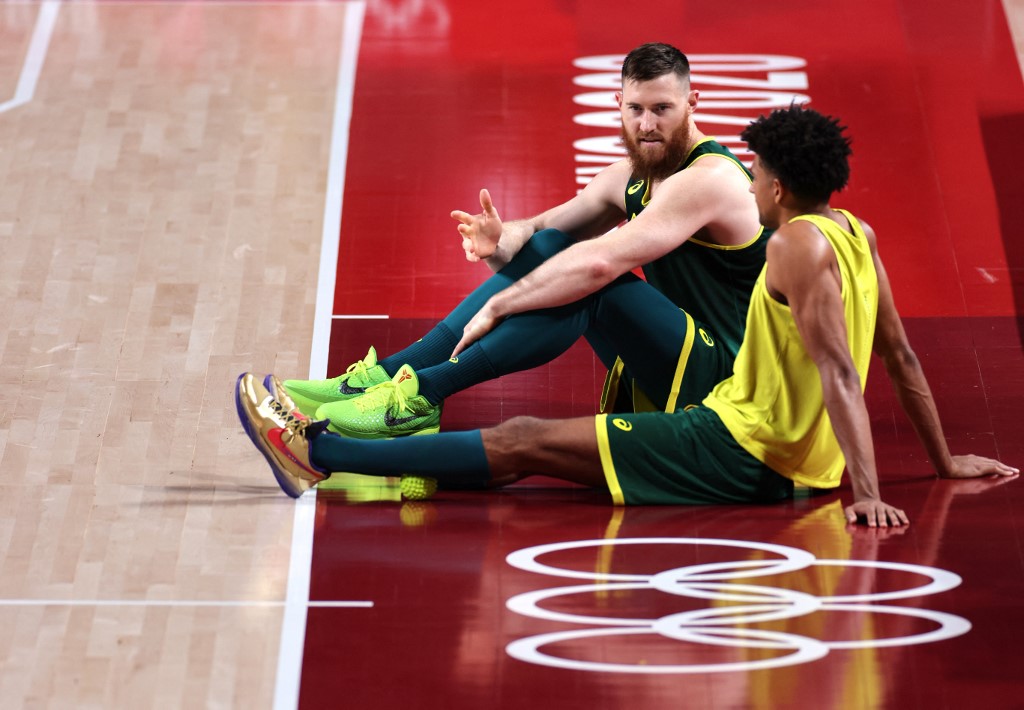 Australia's Olympic basketball team players Aron Baynes (R) and Josh Green attend a training session at the Saitama Super Arena in Saitama on July 23, 2021, ahead of the Tokyo 2020 Olympic Games. 