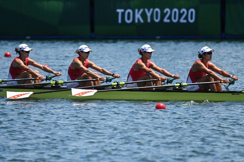 (L-R) China's Chen Yunxia, China's Zhang Ling, China's Lyu Yang and China's Cui Xiaotong compete in the women's quadruple sculls rowing heats during the Tokyo 2020 Olympic Games at the Sea Forest Waterway in Tokyo on July 23, 2021. 