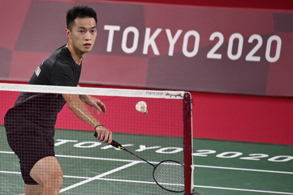 Hong Kong's Angus Ng Ka Long hits a shot to Mexico's Lino Munoz in their men's singles badminton group stage match during the Tokyo 2020 Olympic Games at the Musashino Forest Sports Plaza in Tokyo on July 24, 2021. 