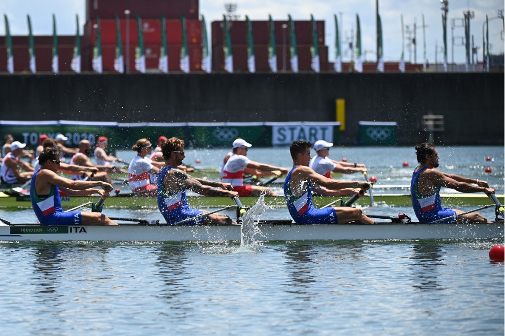 (L-R) Italy's Matteo Castaldo, Italy's Bruno Rosetti, Italy's Matteo Lodo and Italy's Giuseppe Vicino compete in the men's four heats during the Tokyo 2020 Olympic Games at the Sea Forest Waterway in Tokyo on July 24, 2021. 