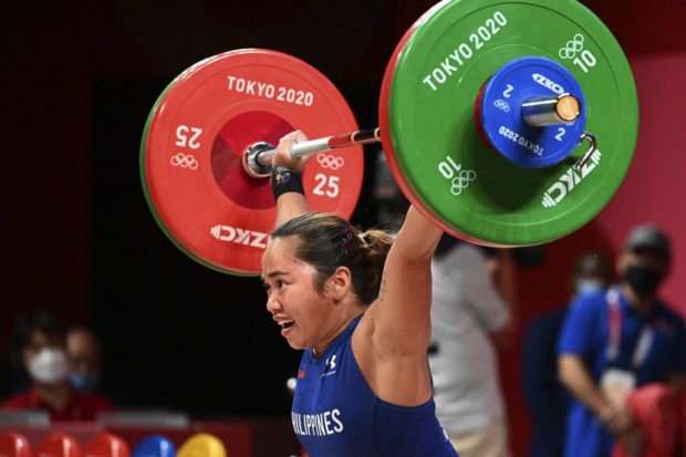 Philippines' Hidilyn Diaz competes in the women's 55kg weightlifting competition during the Tokyo 2020 Olympic Games at the Tokyo International Forum in Tokyo on July 26, 2021.