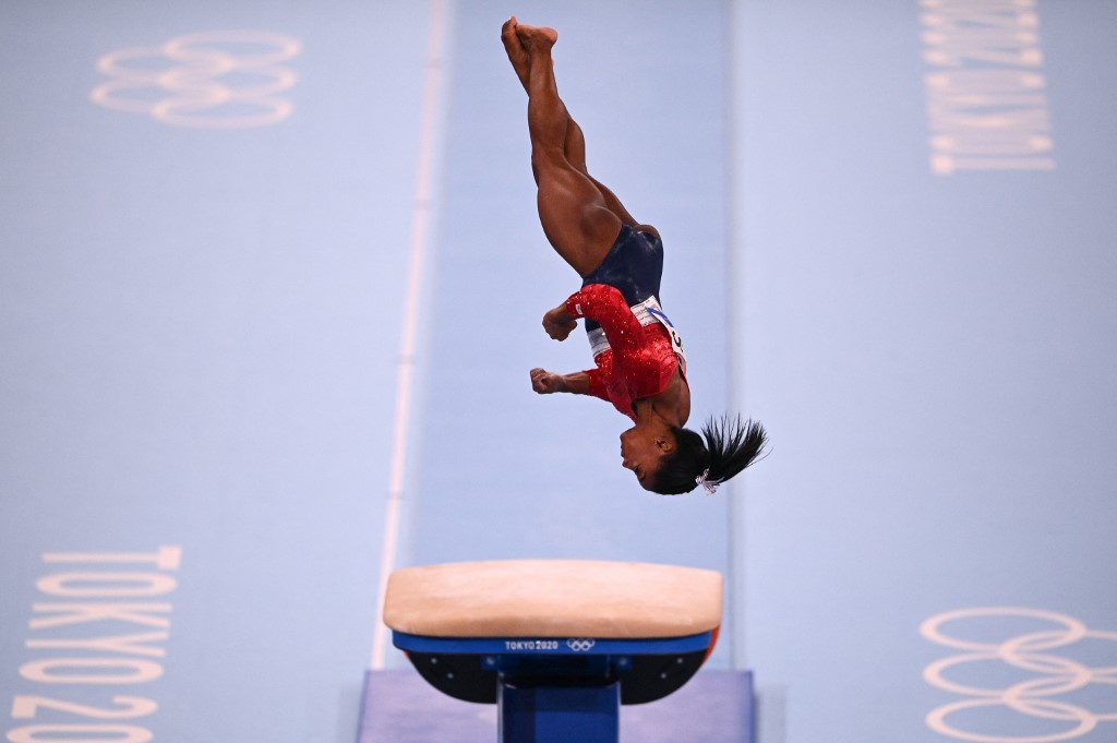 US's Simone Biles competes in the vault event of the artistic gymnastics women's team final during the Tokyo 2020 Olympic Games at the Ariake Gymnastics Centre in Tokyo on July 27, 2021.
