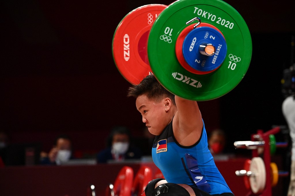 Philippines' Elreen Ann Ando competes in the women's 64kg weightlifting competition during the Tokyo 2020 Olympic Games at the Tokyo International Forum in Tokyo on July 27, 2021.