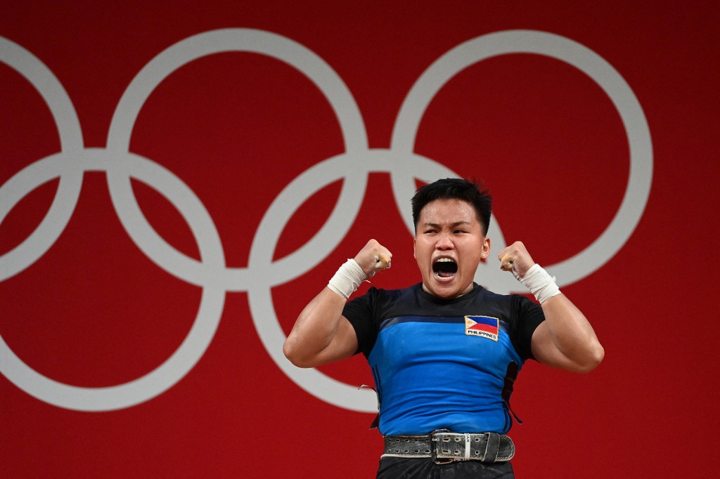 Philippines' Elreen Ann Ando reacts during the women's 64kg weightlifting competition during the Tokyo 2020 Olympic Games at the Tokyo International Forum in Tokyo on July 27, 2021.