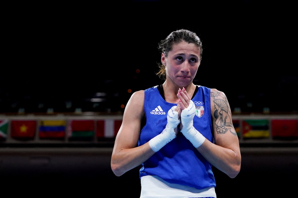 Italy's Irma Testa celebrates after winning against Canada's Caroline Veyre at the end of their women's feather (54-57kg) quarter-final boxing match during the Tokyo 2020 Olympic Games at the Kokugikan Arena in Tokyo on July 28, 2021.