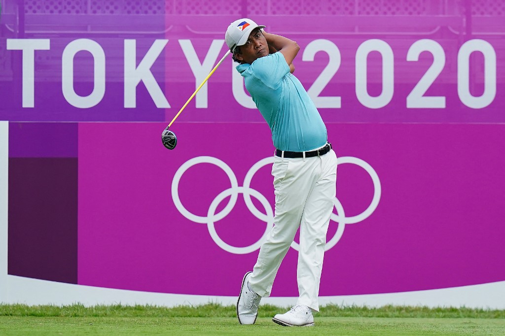 Philippines' Juvic Pagunsan watches his drive from a tee in round 1 of the mens golf individual stroke play during the Tokyo 2020 Olympic Games at the Kasumigaseki Country Club in Kawagoe on July 29, 2021.