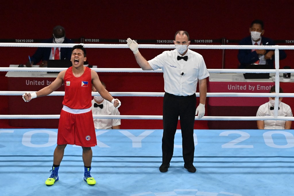 Philippines' Nesthy Petecio celebrates after winning against Italy's Irma Testa after their women's feather (54-57kg) semi-final boxing match during the Tokyo 2020 Olympic Games at the Kokugikan Arena in Tokyo on July 31, 2021.