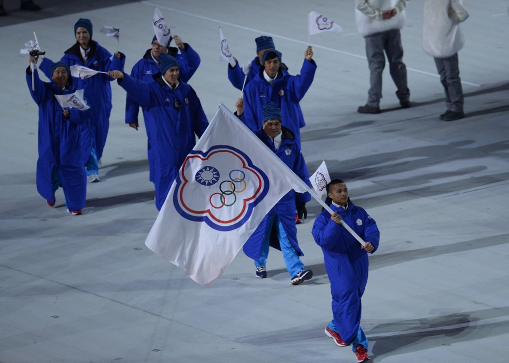 Taiwan's flag bearer, speed skater Sung Ching-Yang leads his national delegation during the Opening Ceremony of the Sochi Winter Olympics at the Fisht Olympic Stadium on February 7, 2014 in Sochi