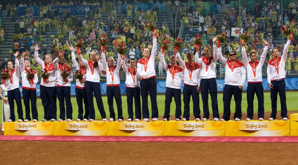 The US softball team wave with their silver medals on the podium at the awards ceremony after their 2008 Beijing Olympic Games softball gold medal match loss to Japan at the Fengtai stadium on August 21, 2008. 