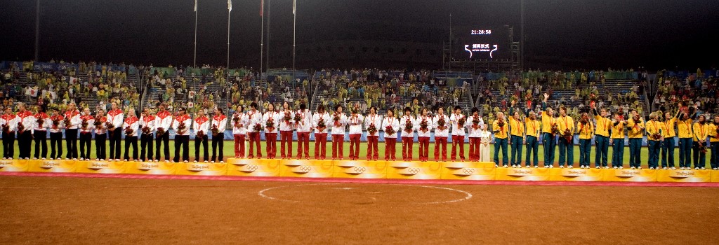 The softball teams from Japan (C), the US (L) and Australia (R) pose on the podium during the awards ceremony after the 2008 Beijing Olympic Games softball gold medal match between the US and Japan at the Fengtai stadium on August 21, 2008.