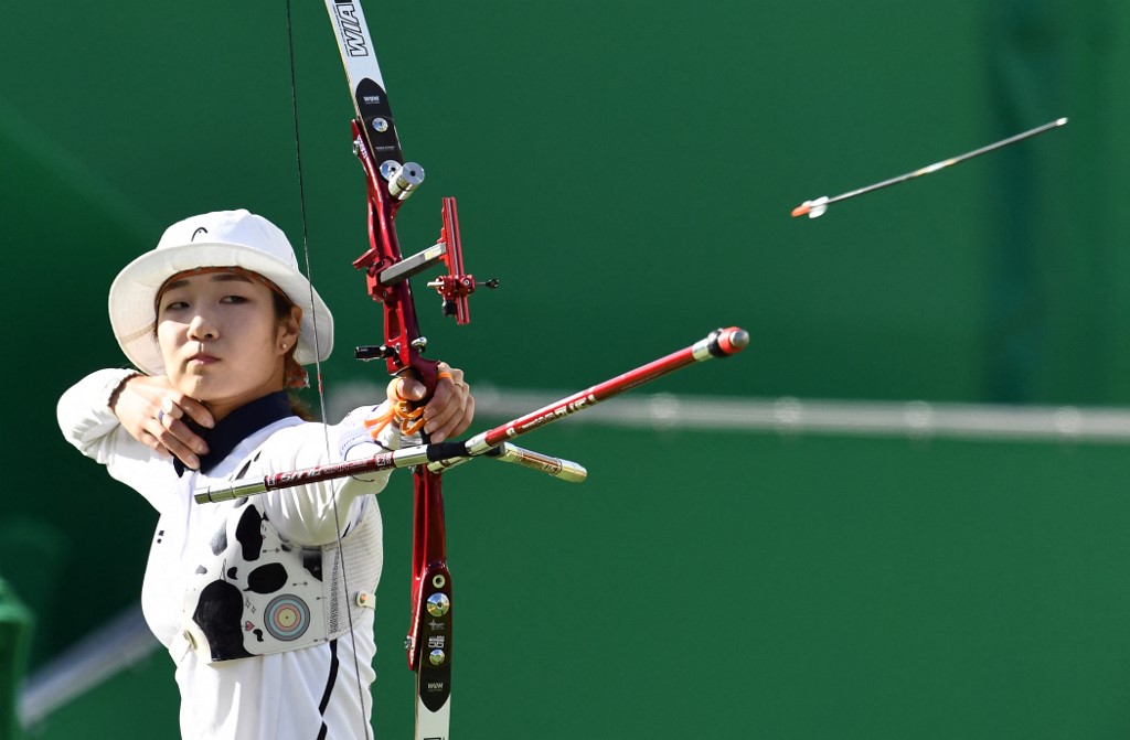 Korea's Misun Choi shoots an arrow during the Rio 2016 Olympic Games women's quarterfinal match at the Sambodromo archery venue in Rio de Janeiro, Brazil on August 11, 2016.