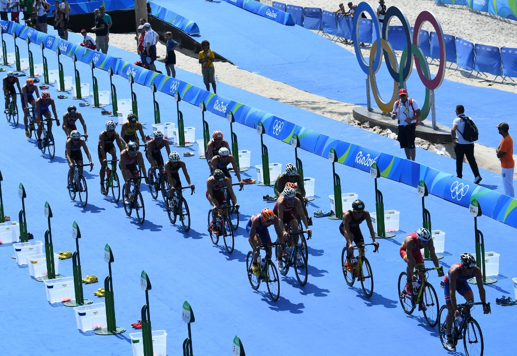 Athletes take part in the cycling portion of the men's triathlon at Fort Copacabana during the Rio 2016 Olympic Games in Rio de Janeiro on August 18, 2016