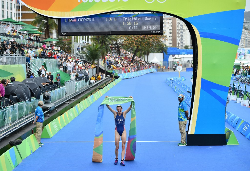 USA's Gwen Jorgensen wins the gold medal in the women's triathlon at Fort Copacabana during the Rio 2016 Olympic Games in Rio de Janeiro on August 20, 2016.