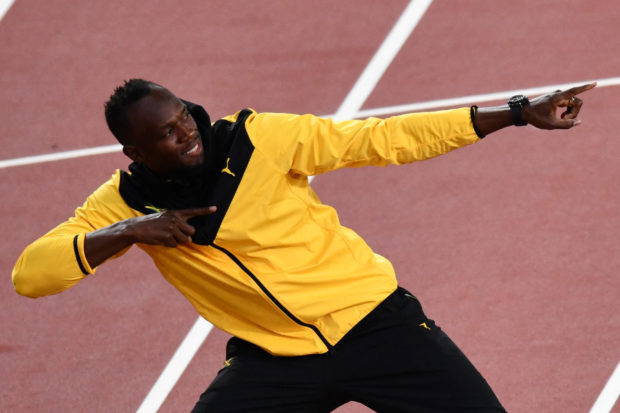 Jamaica's Usain Bolt poses as he takes part in a lap of honour on the final day of the 2017 IAAF World Championships at the London Stadium in London on August 13, 2017.