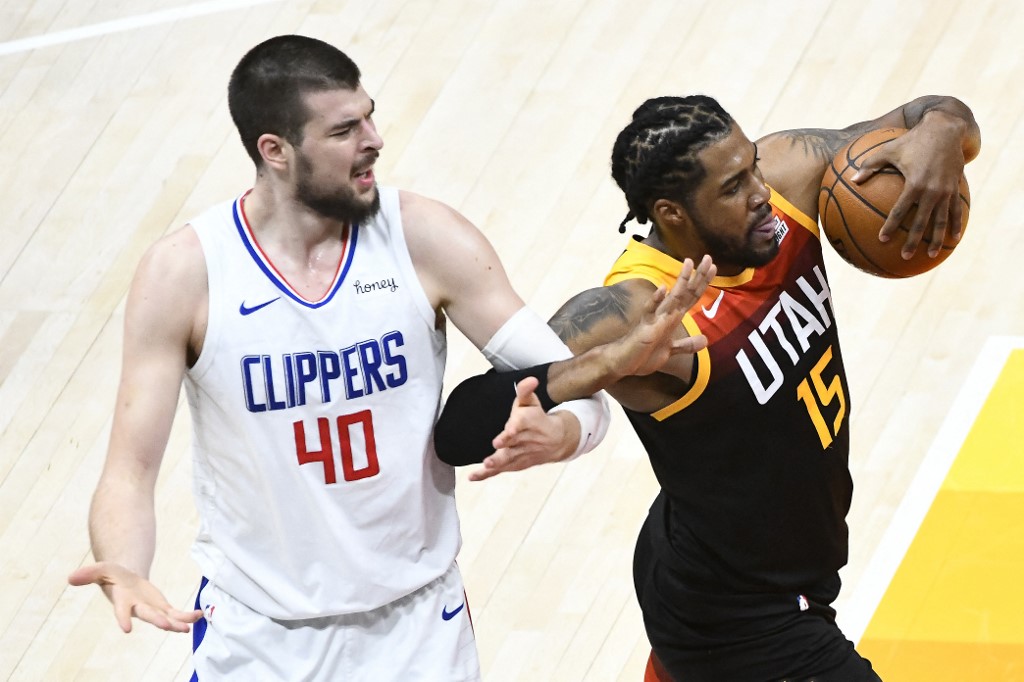 Ivica Zubac #40 of the Los Angeles Clippers fouls Derrick Favors #15 of the Utah Jazz in Game One of the Western Conference second-round playoff series at Vivint Smart Home Arena on June 8, 2021 in Salt Lake City, Utah. 