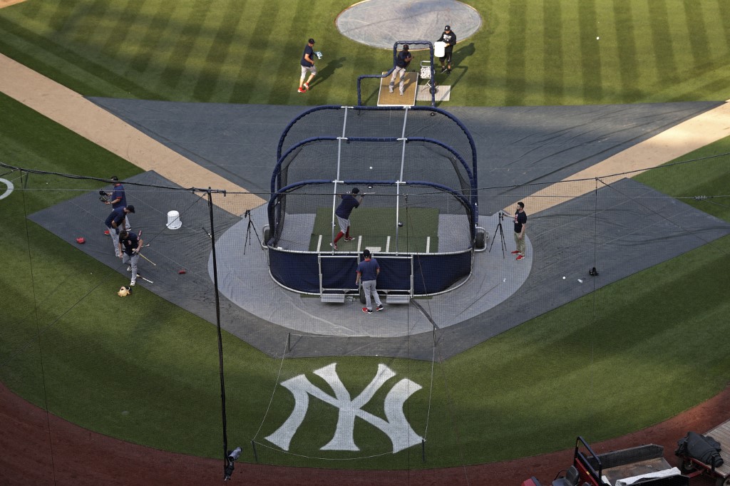 Members of the Boston Red Sox take batting practice at Yankee Stadium on July 15, 2021 in the Bronx borough of New York City. The game between the Red Sox and the New York Yankees was postponed due to positive COVID-19 tests within the Yankee organization among New York pitchers Jonathan Loaisiga, Nestor Cortes Jr. and Wandy Peralta.   
