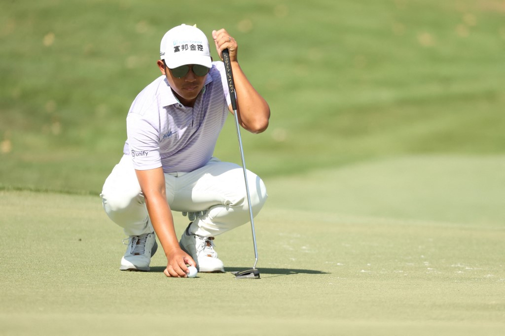 C.T. Pan of Taiwan lines up a putt on the tenth green during the final round of The Honda Classic at PGA National Champion course on March 21, 2021 in Palm Beach Gardens, Florida.
