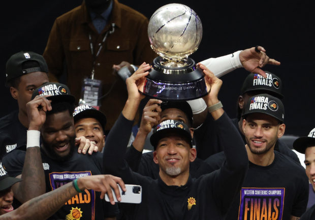Head Coach Monty Williams of the Phoenix Suns holds the Western Conference Championship trophy after the Suns defeated the LA Clippers in Game Six of the Western Conference Finals at Staples Center on June 30, 2021 in Los Angeles, California. NOTE TO USER: User expressly acknowledges and agrees that, by downloading and or using this photograph, User is consenting to the terms and conditions of the Getty Images License Agreement.   Ronald Martinez/Getty Images/AFP (Photo by RONALD MARTINEZ / GETTY IMAGES NORTH AMERICA / Getty Images via AFP)