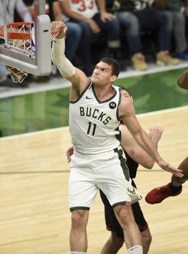 Brook Lopez #11 of the Milwaukee Bucks dunks against the Atlanta Hawks during the first quarter in Game Five of the Eastern Conference Finals at Fiserv Forum on July 01, 2021 in Milwaukee, Wisconsin. NOTE TO USER: User expressly acknowledges and agrees that, by downloading and or using this photograph, User is consenting to the terms and conditions of the Getty Images License Agreement. Patrick McDermott/Getty Images/AFP (Photo by Patrick McDermott / GETTY IMAGES NORTH AMERICA / Getty Images via AFP)