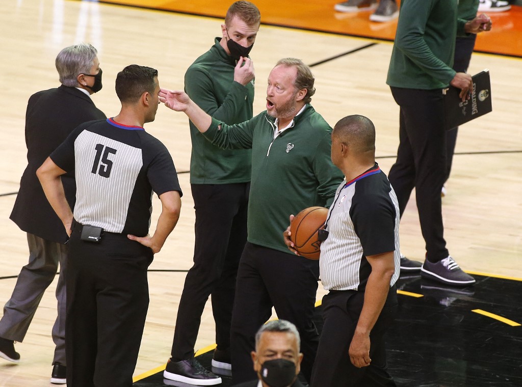 Head coach Mike Budenholzer of the Milwaukee Bucks argues with referee Zach Zarba #15 during the first half in Game Two of the NBA Finals against the Phoenix Suns at Phoenix Suns Arena on July 08, 2021 in Phoenix, Arizona.