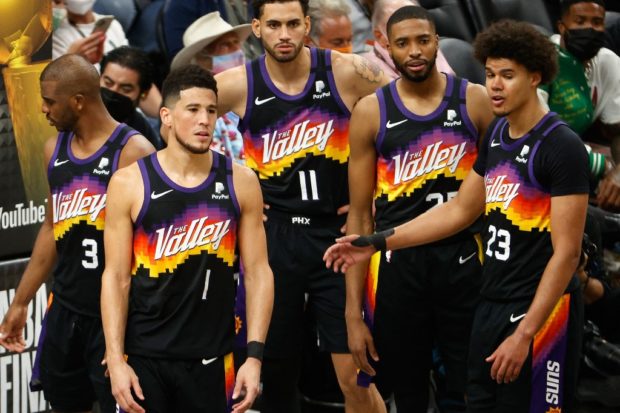 Chris Paul #3, Devin Booker #1, Abdel Nader #11, Mikal Bridges #25 and Cameron Johnson #23 of the Phoenix Suns in game two of the NBA Finals at Phoenix Suns Arena on July 08, 2021