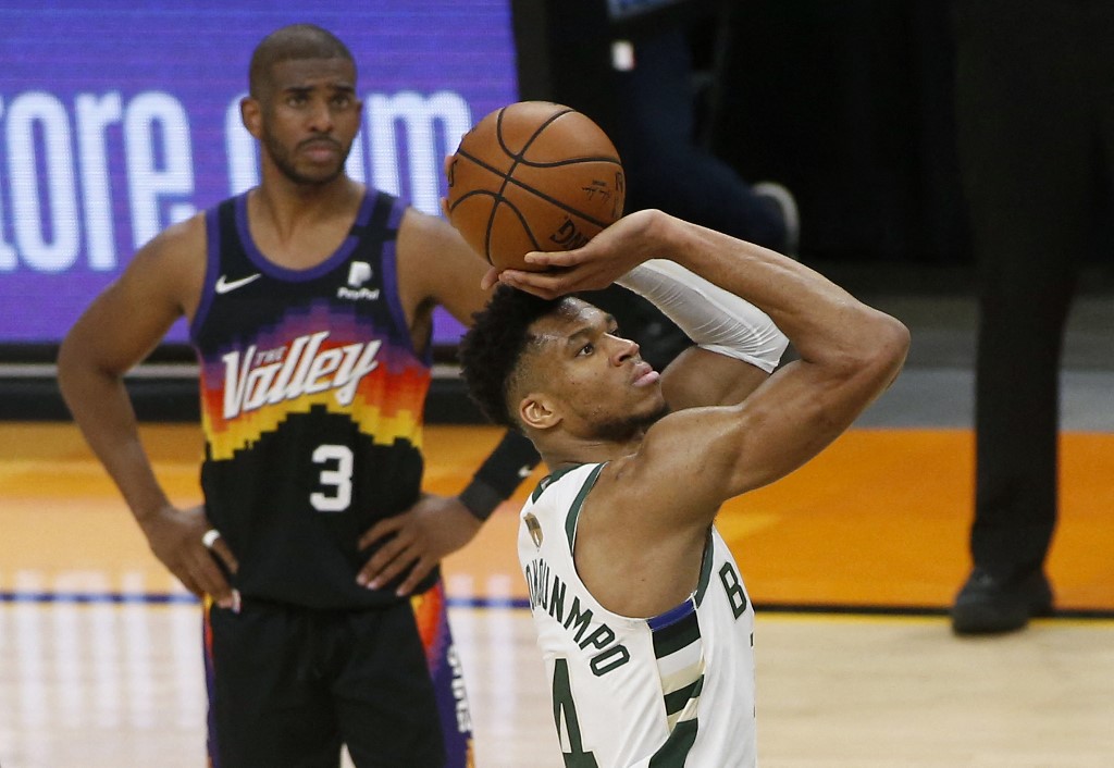 Giannis Antetokounmpo #34 of the Milwaukee Bucks shoots a free throw as Chris Paul #3 of the Phoenix Suns watches during the second half in Game Two of the NBA finals at Phoenix Suns Arena on July 08, 2021 in Phoenix, Arizona.   