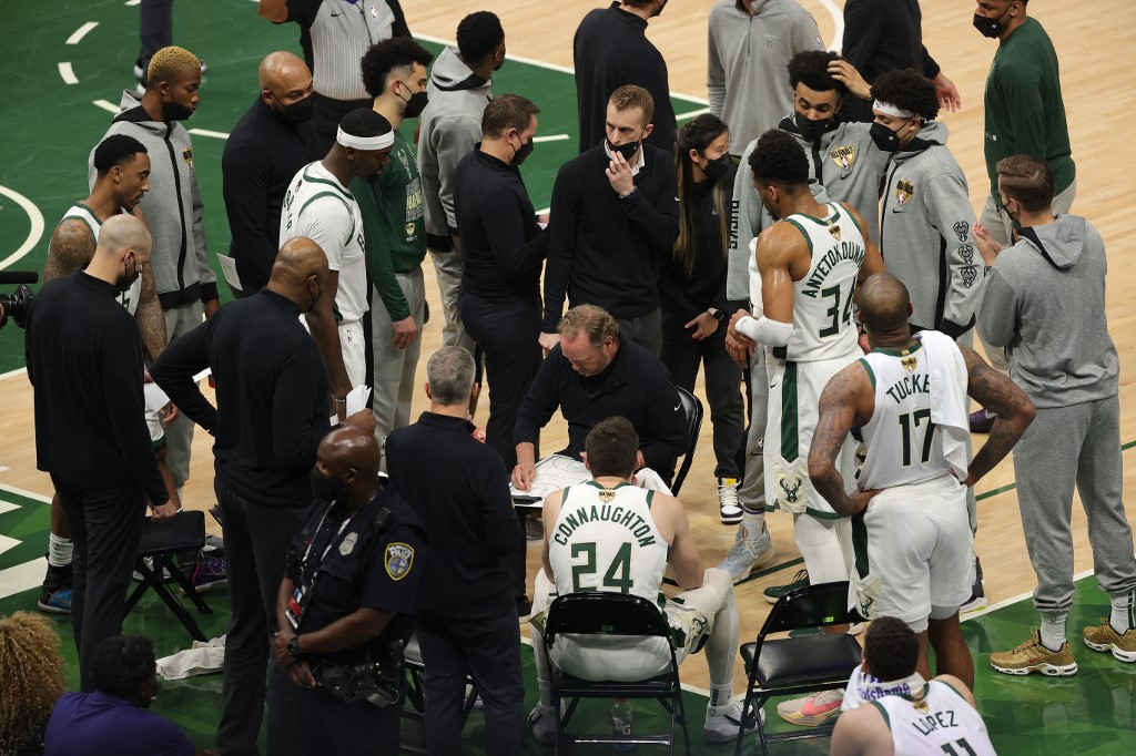 Mike Budenholzer of the Milwaukee Bucks huddles his team during the first half in Game Four of the NBA Finals against the Phoenix Suns at Fiserv Forum on July 14, 2021 in Milwaukee, Wisconsin