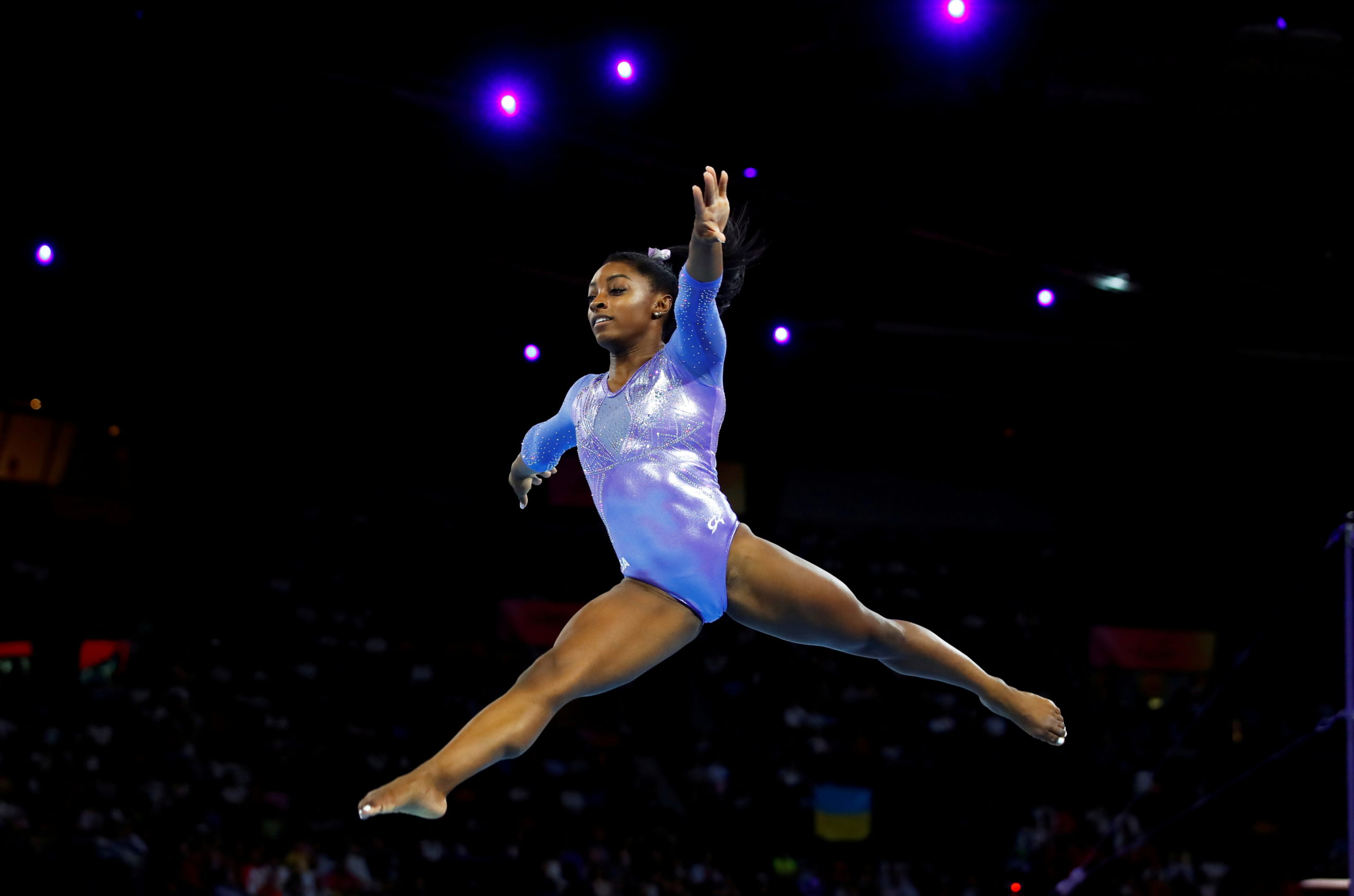 FILE PHOTO: Simone Biles of the U.S. in action - Artistic Gymnastics - 2019 World Artistic Gymnastics Championships - Women's Floor Final - Hanns-Martin-Schleyer-Halle, Stuttgart, Germany - October 13, 2019 REUTERS/Wolfgang Rattay/File Photo/File Photo
