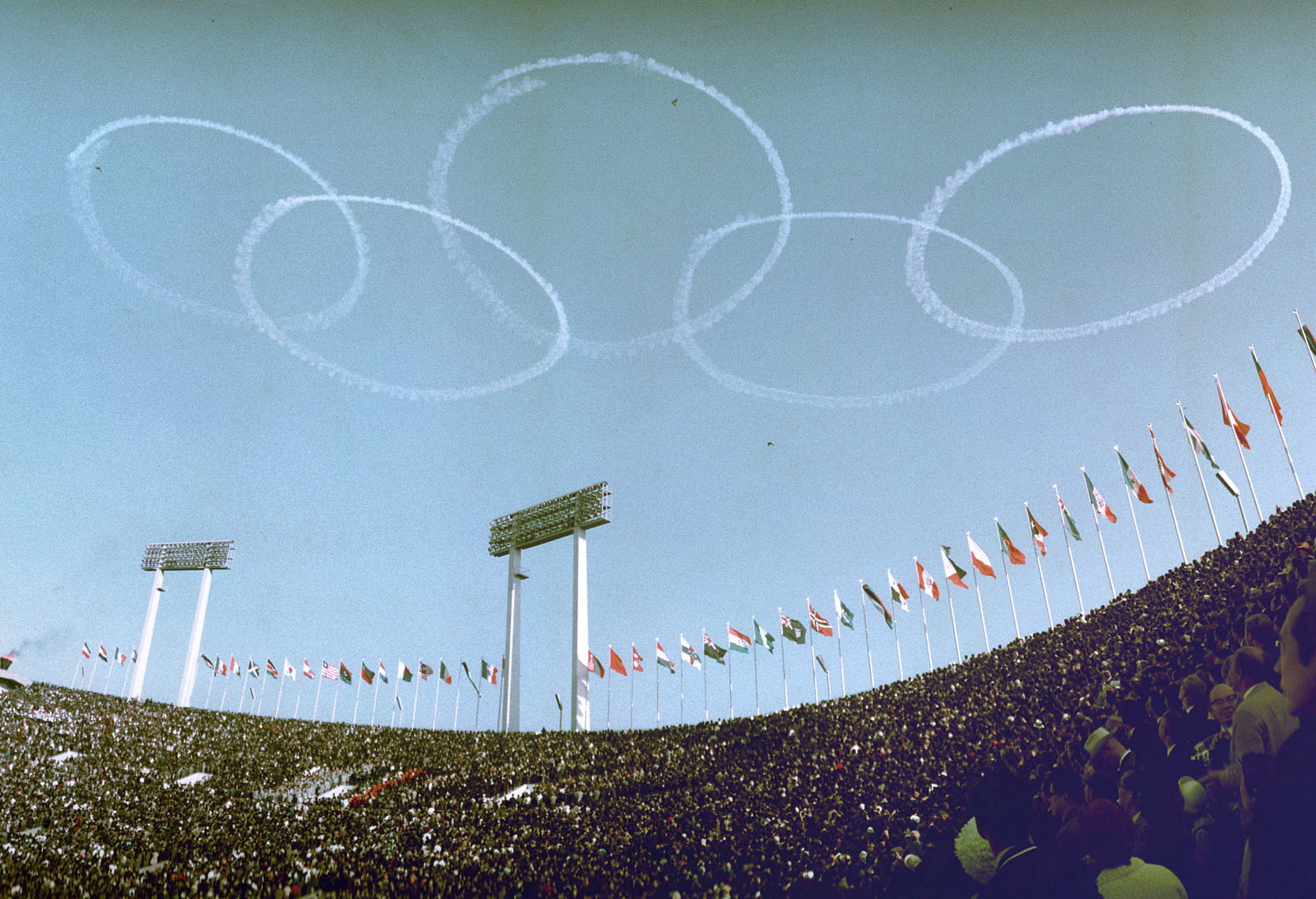 Japanese air force's aerobatic team Blue Impulse draws Olympic rings in the sky at the opening ceremony of the 1964 Tokyo Olympic Games, over the captial in Japan in this photo taken by Kyodo October 10, 1964. Picture taken October 10, 1964. Mandatory credit Kyodo via REUTERS