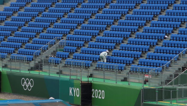 A worker inspects seats at Tokyo2020 Olympic BMX Track in preparation for the Tokyo 2020 Olympic Games in Tokyo, Japan June 30, 2021. Picture Taken June 30, 2021. 