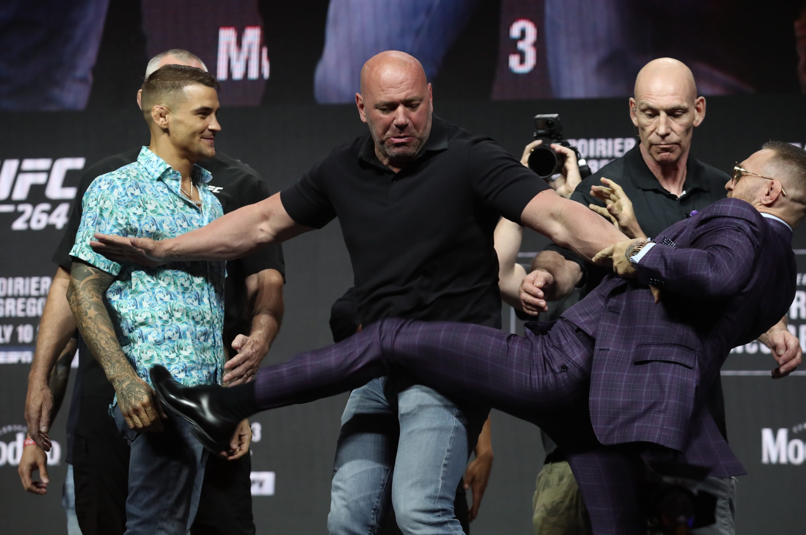 FILE PHOTO: MMA - UFC264  - Dustin Poirier v Conor McGregor - Press conference - T-Mobile Arena, Las Vegas, United States - July 8, 2021 Conor McGregor throws a kick to Dustin Poirier  during press conference with Dana White President of the UFC REUTERS/Steve Marcus