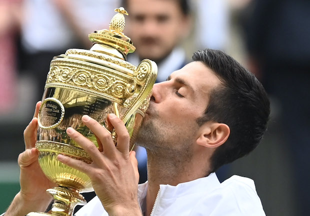 Novka Djokovic kisses trophy at Wimbledon