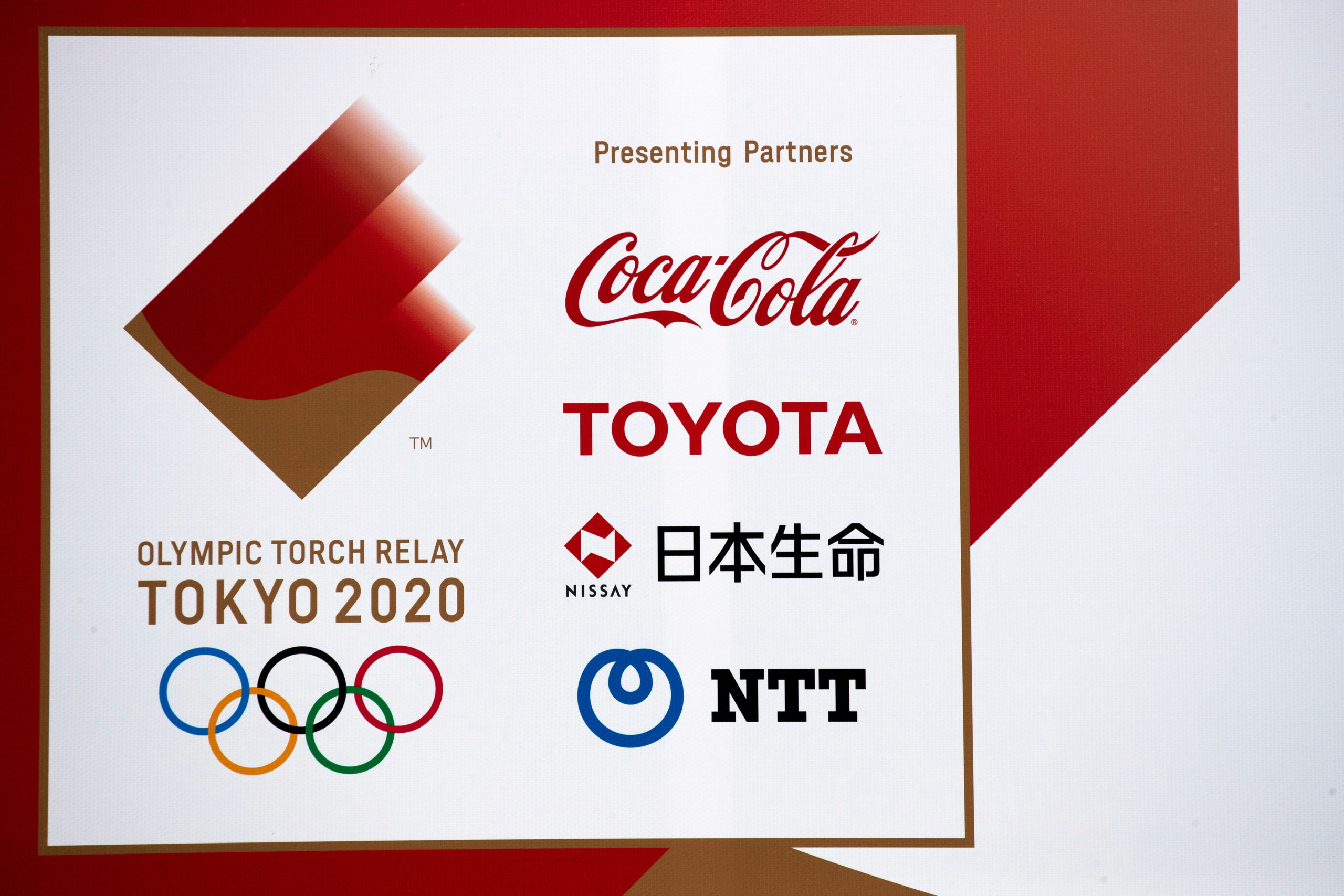 A banner advertising Coca-Cola beverages, Toyota, Nissay and NTT, Olympic Games partner for Tokyo 2020, in Fukushima prefecture, Japan March 8, 2020. Picture taken March 8, 2020. 