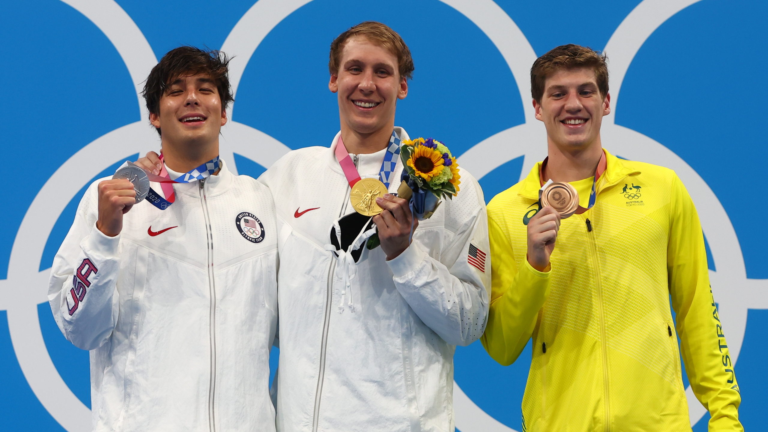 Tokyo 2020 Olympics - Swimming - Men's 400m Individual Medley - Medal Ceremony - Tokyo Aquatics Centre - Tokyo, Japan - July 25, 2021. Gold medalist Chase Kalisz of the United States, silver medalist Jay Litherland of the United States and bronze medalist Brendon Smith of Australia pose on the podium 