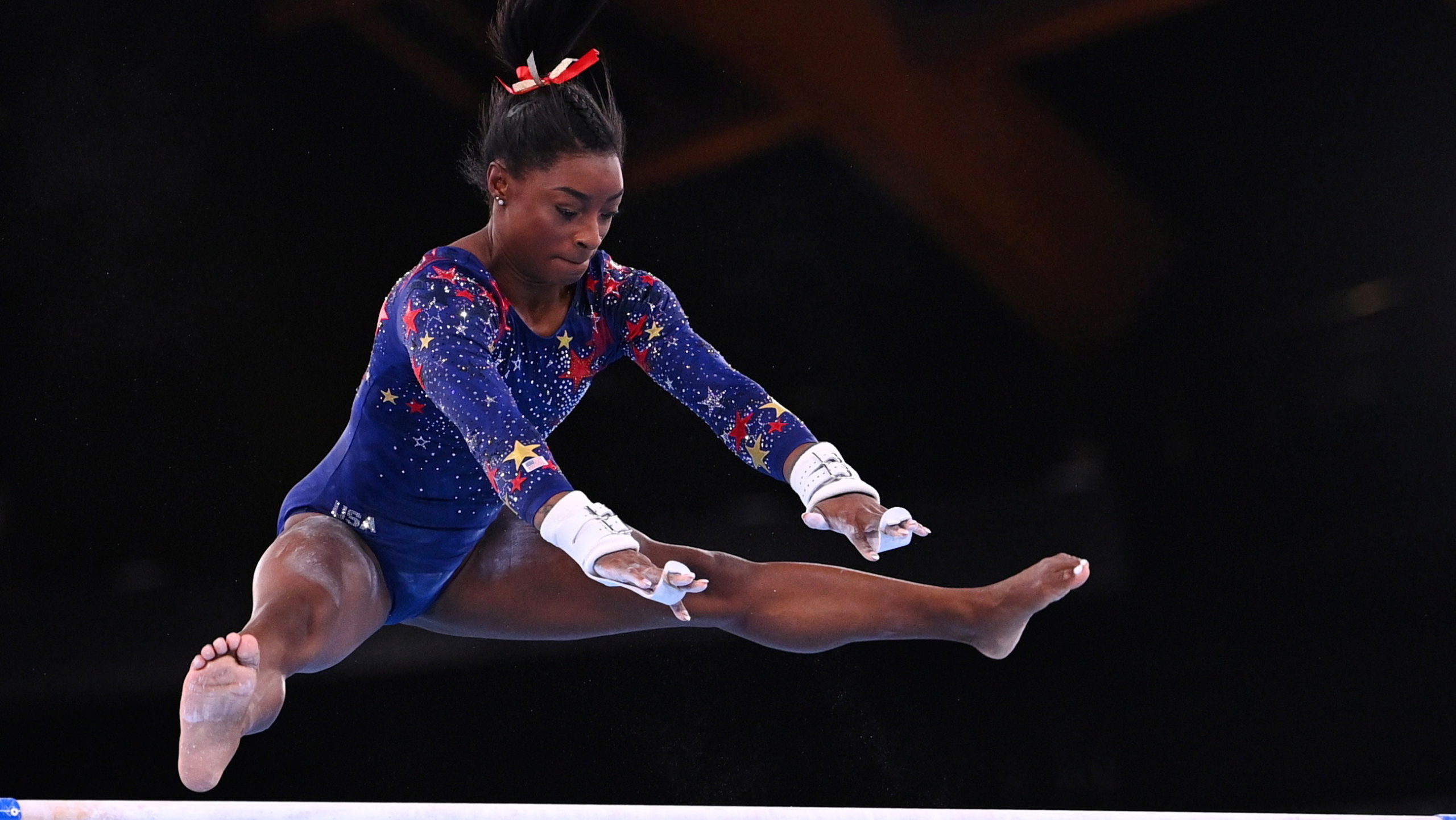 Tokyo 2020 Olympics - Gymnastics - Artistic - Women's Uneven Bars - Qualification - Ariake Gymnastics Centre, Tokyo, Japan - July 25, 2021. Simone Biles of the United States in action on the uneven bars. REUTERS/Dylan Martinez