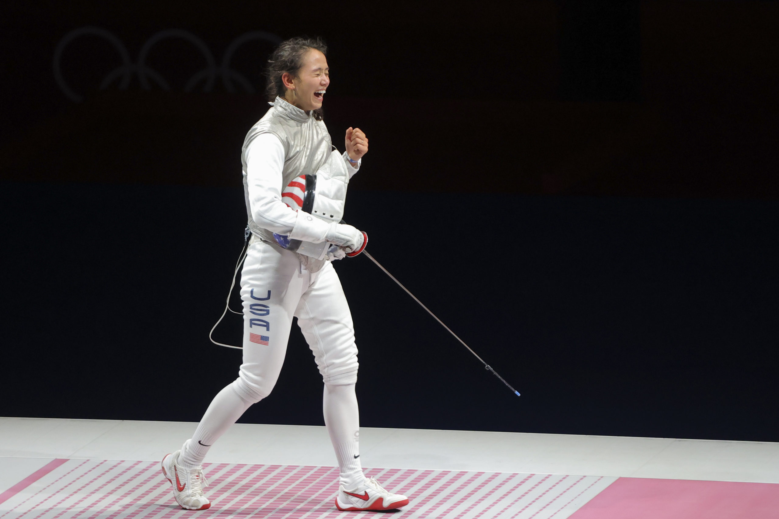 Olympics - Fencing - Women's Individual Foil - Gold medal match - Makuhari Messe Hall B - Chiba, Japan - July 25, 2021. Lee Kiefer of the United States celebrates after winning gold 