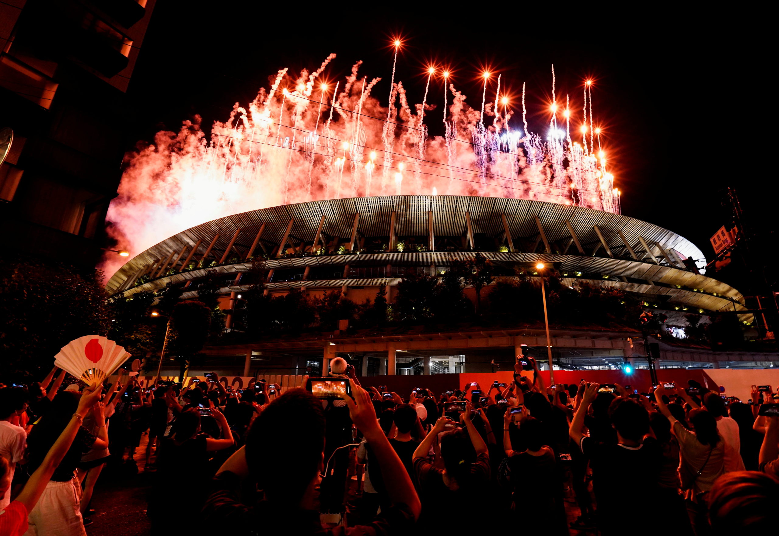 FILE PHOTO: Tokyo 2020 Olympics - The Tokyo 2020 Olympics Opening Ceremony - Olympic Stadium, Tokyo, Japan - July 23, 2021. Fireworks are seen from outside the stadium during the Opening Ceremony