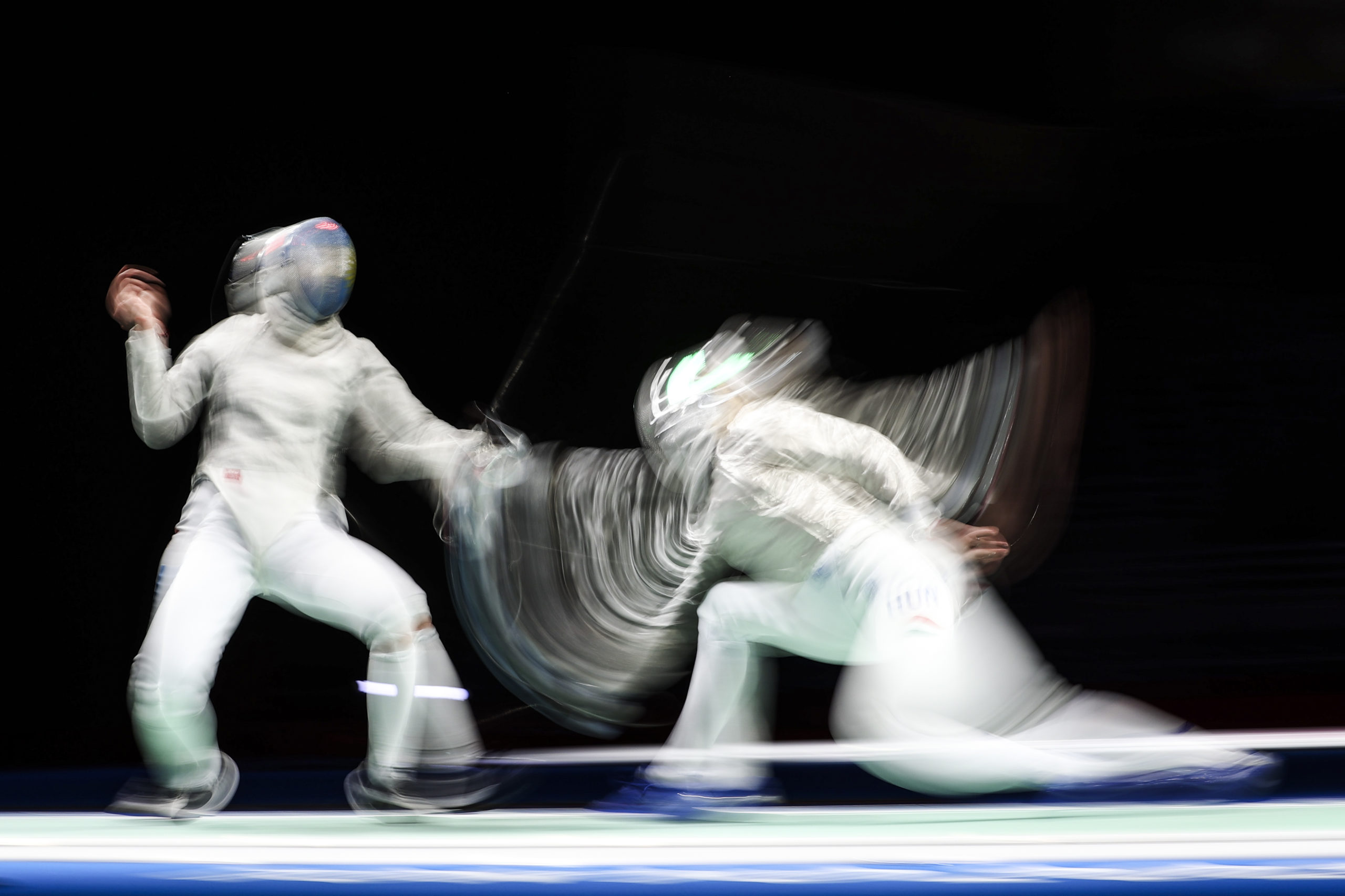 Tokyo 2020 Olympics - Fencing - Women's Individual Sabre - Last 32 - Makuhari Messe Hall B - Chiba, Japan - July 26, 2021. Maria Perez Maurice of Argentina in action against Anna Marton of Hungary 