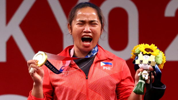Gold medalist Hidilyn Diaz of the Philippines reacts.