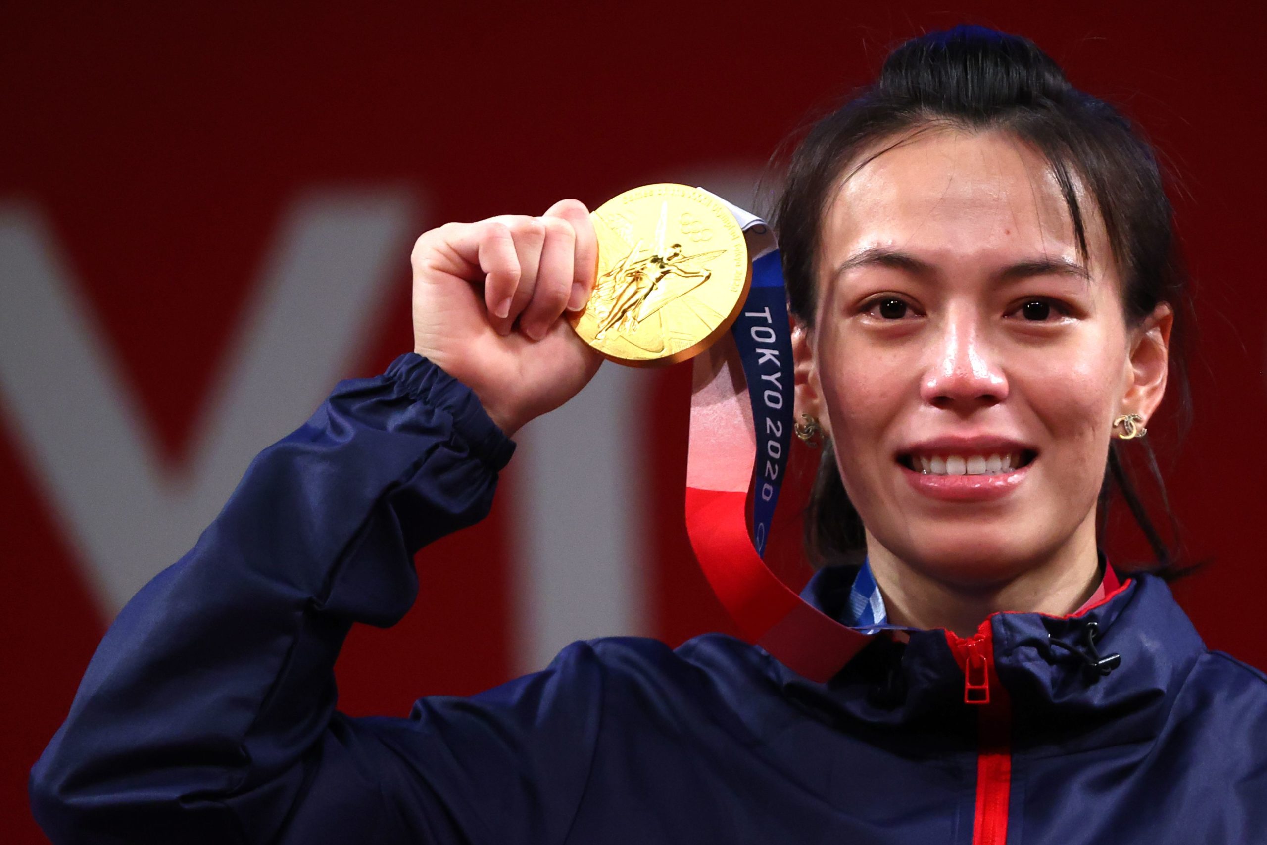 Tokyo 2020 Olympics - Weightlifting - Women's 59kg - Medal Ceremony - Tokyo International Forum, Tokyo, Japan - July 27, 2021. Gold medalist Kuo Hsing-Chun of Taiwan reacts. 