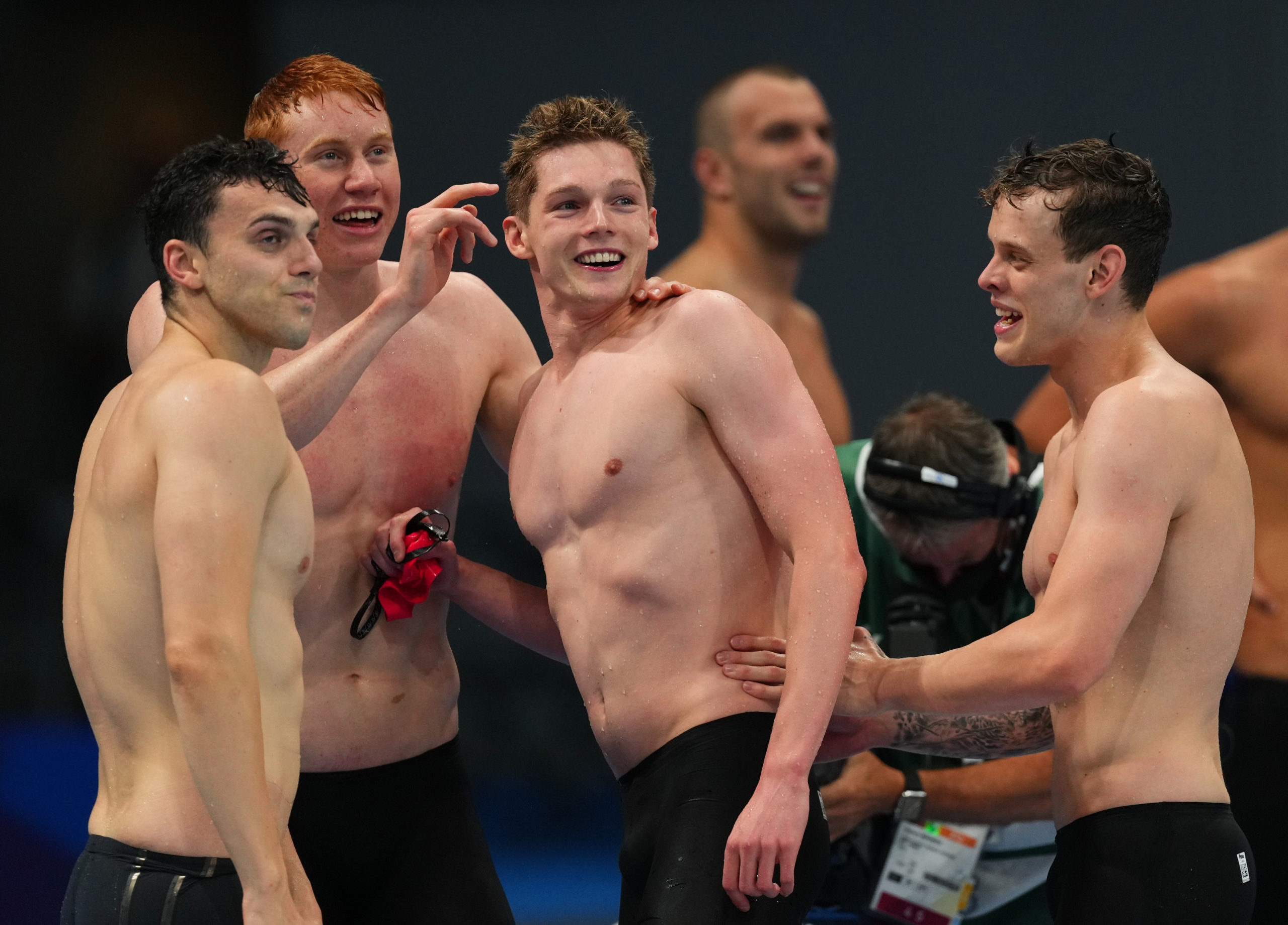 Tokyo 2020 Olympics - Swimming - Men's 4 x 200m Freestyle Relay - Medal Ceremony - Tokyo Aquatics Centre - Tokyo, Japan - July 28, 2021. Tom Dean of Britain, James Guy of Britain, Matthew Richards of Britain and Duncan Scott of Britain react after winning 