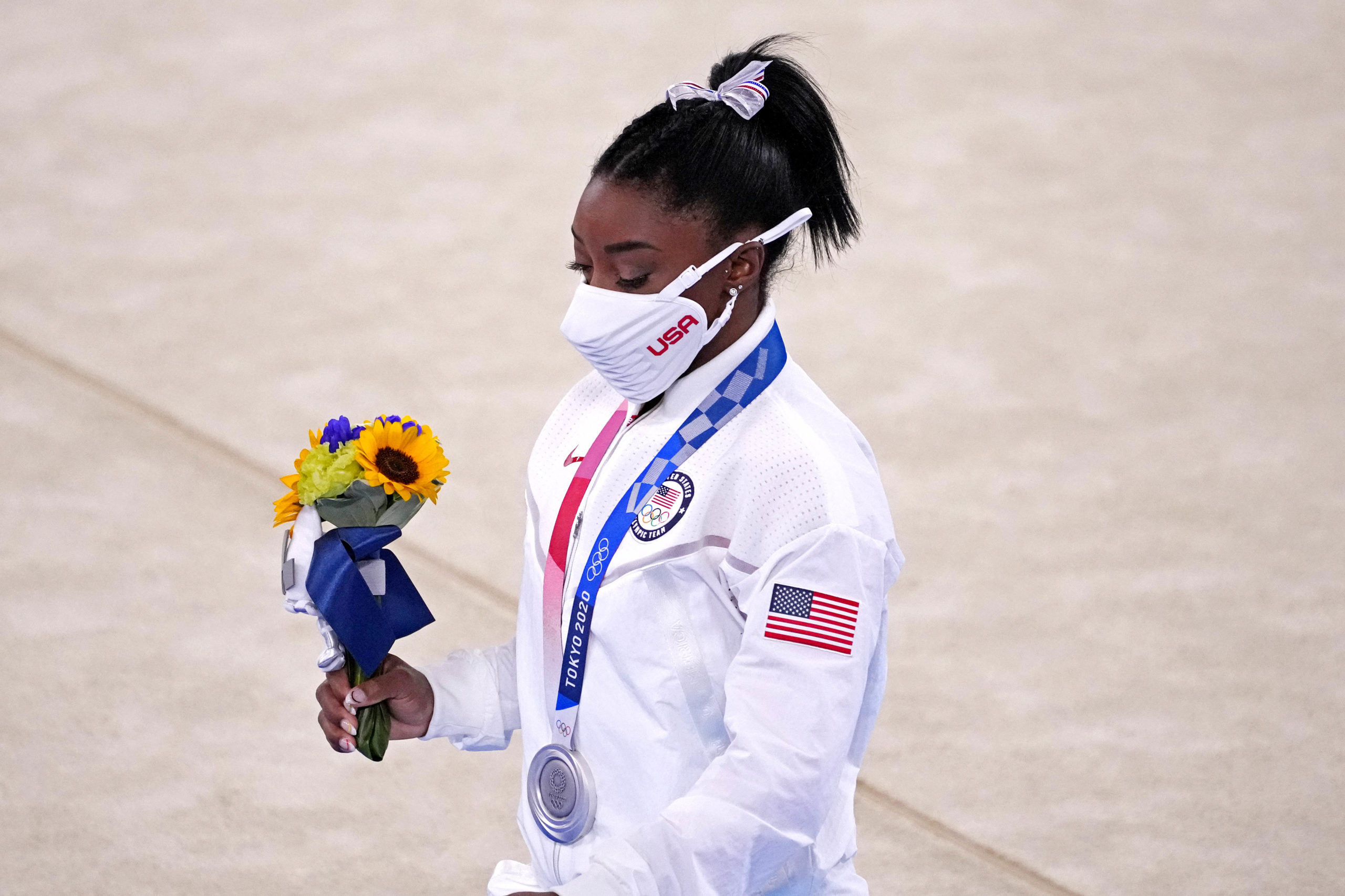 Jul 27, 2021; Tokyo, Japan; Simone Biles (USA) walks off the floor after winning the silver medal in the women's team final during the Tokyo 2020 Olympic Summer Games at Ariake Gymnastics Centre. Mandatory Credit: Robert Deutsch-USA TODAY Sports