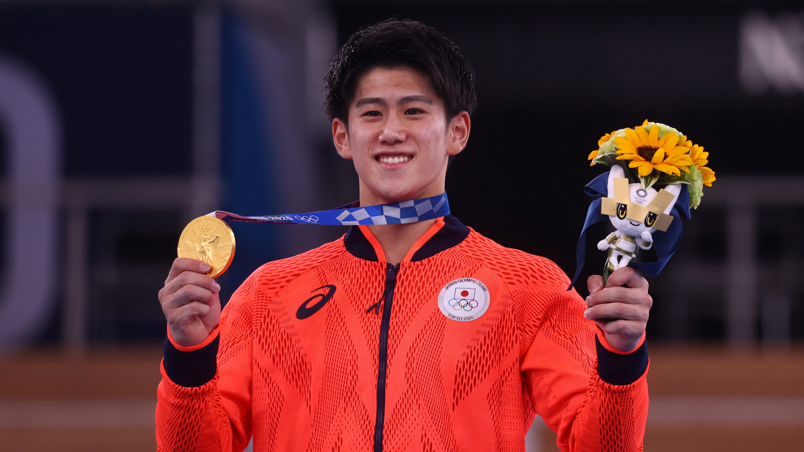 Daiki Hashimoto of Japan celebrates after winning the gold medal in the men's all-around event of the Tokyo Olympics on July 28, 2021.