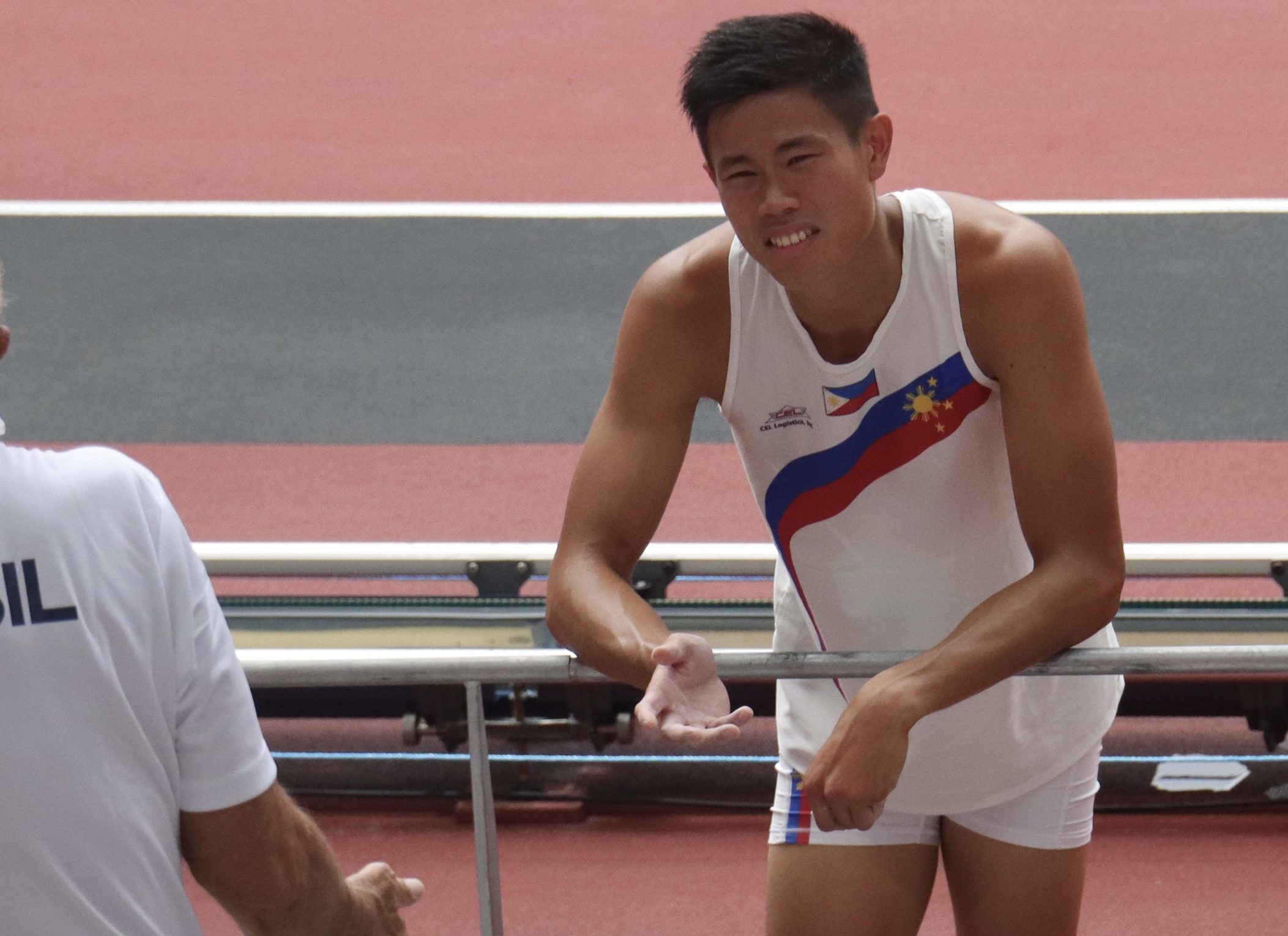 EJ Obiena at the stands after an attempt in the men's pole vault qualification
