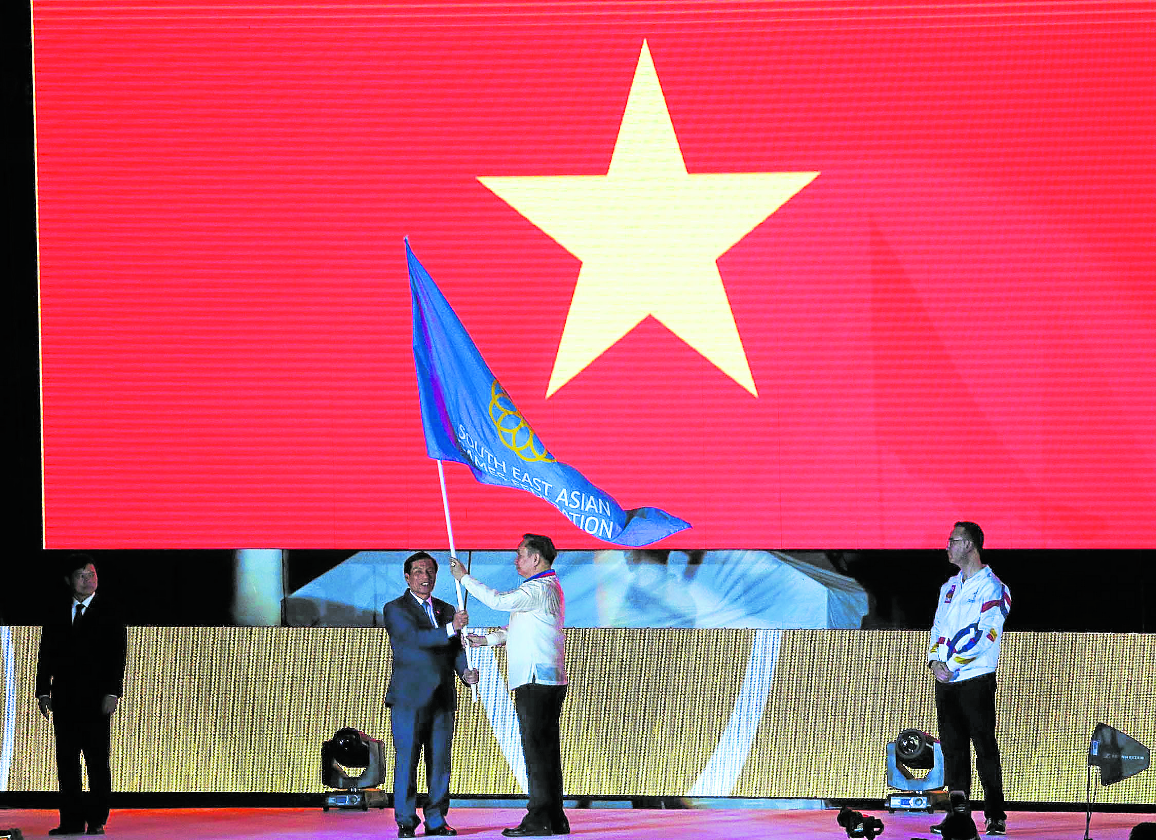 Vietnam receives the SEA Games federation flag during turnover ceremonies of then 2019 Southeast Asian Games. —MARIANNE BERMUDEZ