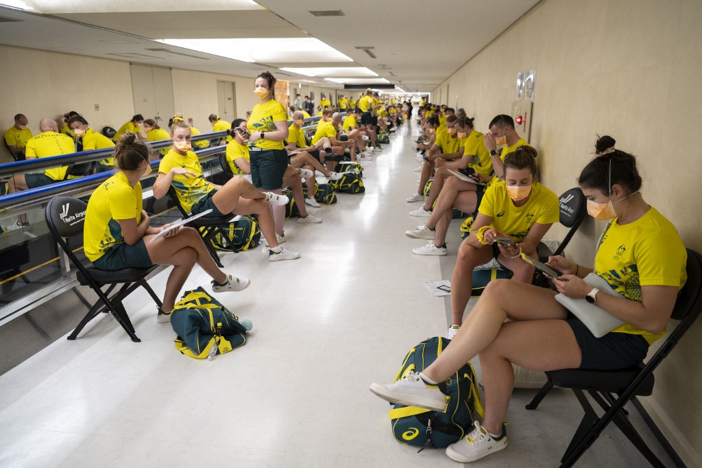 Members of the Australian delegation wait before being tested upon arrival for the Tokyo 2020 Olympic Games at Narita International Airport in Narita, Chiba prefecture on July 17, 2021. 