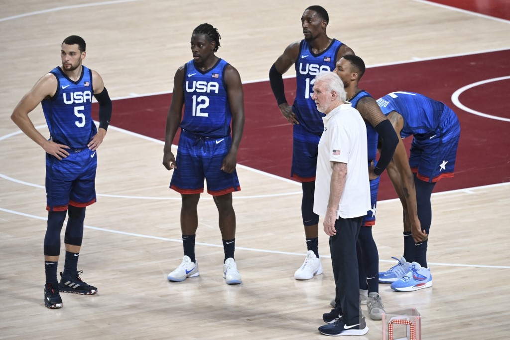 USA's coach Gregg Popovich talks to his players during a time out in the men's preliminary round group A basketball match between France and USA during the Tokyo 2020 Olympic Games at the Saitama Super Arena in Saitama on July 25, 2021. 